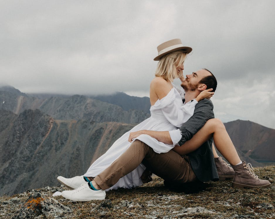 hugging sitting couple.